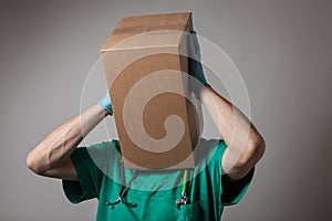 Doctor with cardboard box head