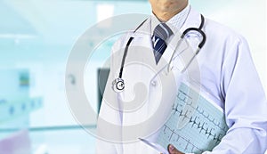 Doctor with cardiograph