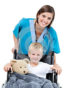 A doctor carrying a little boy