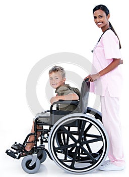 A doctor carrying a patient in a wheelchair