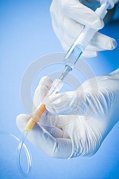 Doctor with catheter and syringe photo