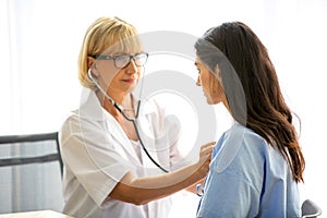 Doctor check up and discuss with patient in clinic or doctor talk with women patient in hospital