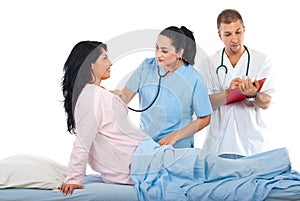 Doctor check up woman patient in bed