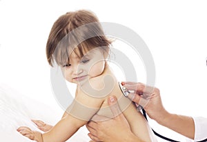 Doctor checking baby with stethoscope on white background