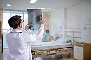 Doctor checking chest x-ray film
