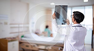 Doctor checking chest x-ray film in hospital