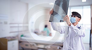 Doctor checking chest x-ray film in hospital