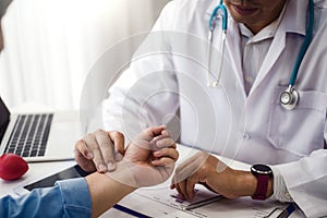 Doctor checking health primary of male patient for consultation health in hospital health. health and doctor concept photo