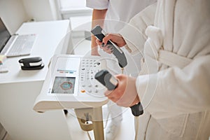 Doctor checking his patient health on a modern equipment