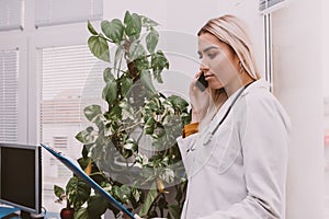 Doctor checking paperwork and talking