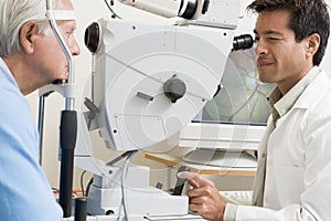 Doctor Checking Patient's Eyes For Glaucoma photo