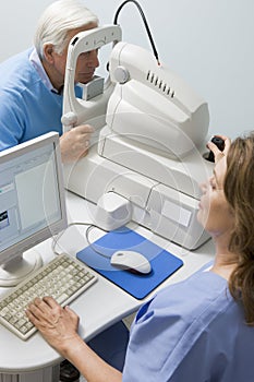 Doctor Checking Patient's Eyes For Glaucoma photo