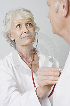 Doctor Checking Patient's Heartbeat Using Stethoscope