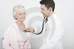 Doctor Checking Patient's Heartbeat Using Stethoscope