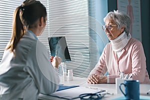 Doctor checking a patient`s x-ray during a visit