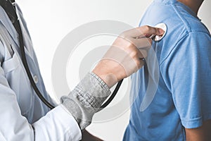 Doctor checking patient with stethoscope listening to heartbeat, Healthcare and medical concept