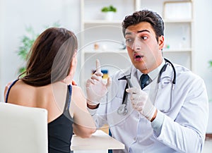 Doctor checking patients ear during medical examination