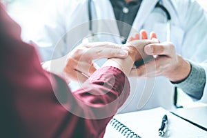 Doctor checking pulse for patients Health care in hospital