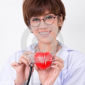 Doctor checking the red heart with ecg line and stethoscope. Isolated on white background. Studio lighting. Concept for healthy