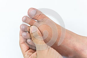 Doctor checks a patient`s toe nails that child because the child`s unusual nails can tell the symptoms of the disease.