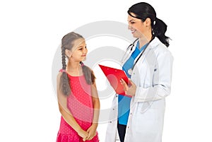 Doctor and child having happy conversation