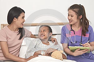 Doctor and child with mother in hospital