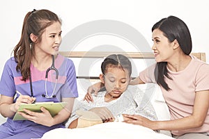 Doctor and child with mother in hospital