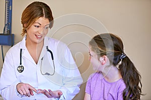 Doctor, child and patient in consultation for healthcare with discussion, medical symptoms and health support