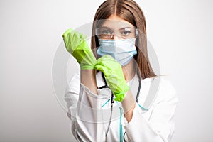Doctor at the clinic changes the protective gloves