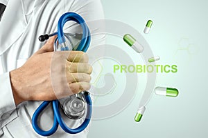 Doctor close-up image of pills and inscription probiotics. The concept of diet, intestinal microflora, microorganisms, healthy