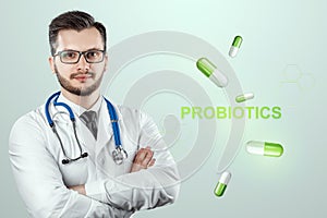 Doctor close-up image of pills and inscription probiotics. The concept of diet, intestinal microflora, microorganisms, healthy