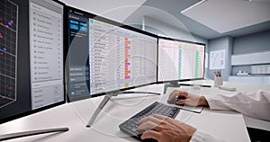 Doctor Coding Medical Bills In Hospital Using Spreadsheet