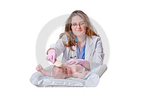 The doctor is combing the hair of a newborn baby, isolated on a white