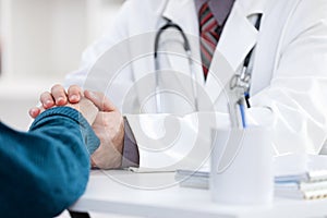 Doctor comforting patient photo