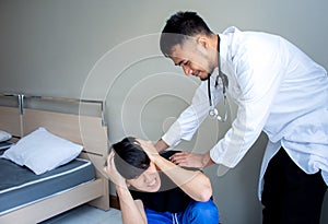 Doctor comforting patient in medical office patient receiving bad news and crying
