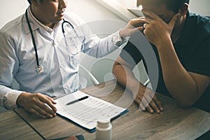 Doctor is comforting the patient after notifying the patient about the outcomes of treatment