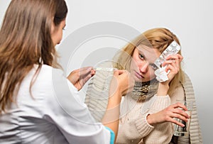 Doctor communicate with patient recommend treatment. Doctor ask patient about symptoms. Flu and cold treatment. Woman