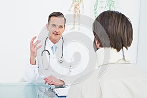 Doctor in communication with patient at medical office