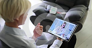 Doctor conducts consultation and advises patient remotely