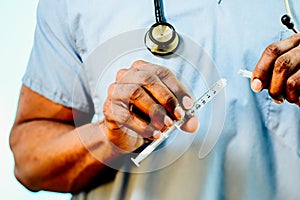 Doctor Connecting Blunt Tip Syringe To An IV