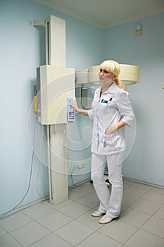 Doctor connects the x-rays equipment photo