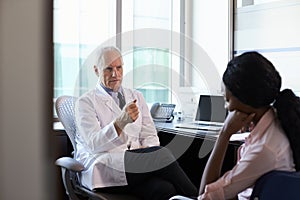 Doctor In Consultation With Depressed Female Patient