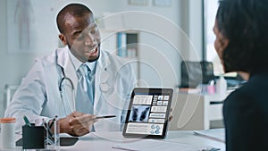 Doctor Consultation Office: Female Patient Listens to Experienced Pulmonologist Uses Digital Table