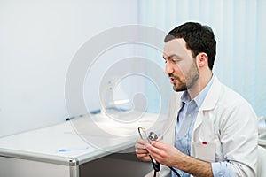 Doctor in consultation with patient sitting in front of him