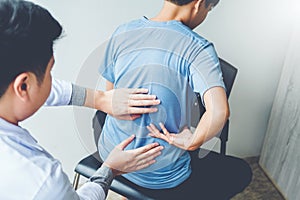 Doctor consulting with patient Back problems Physical therapy co