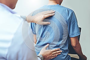 Doctor consulting with patient Back problems Physical therapy co photo