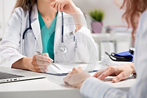 Doctor consulting patient photo