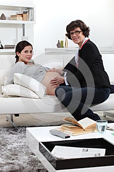 Doctor consulting with pregnant woman