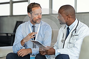 Doctor in conversation with pharmaceutical representative