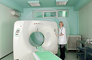 Doctor in CT (CAT) scanner room